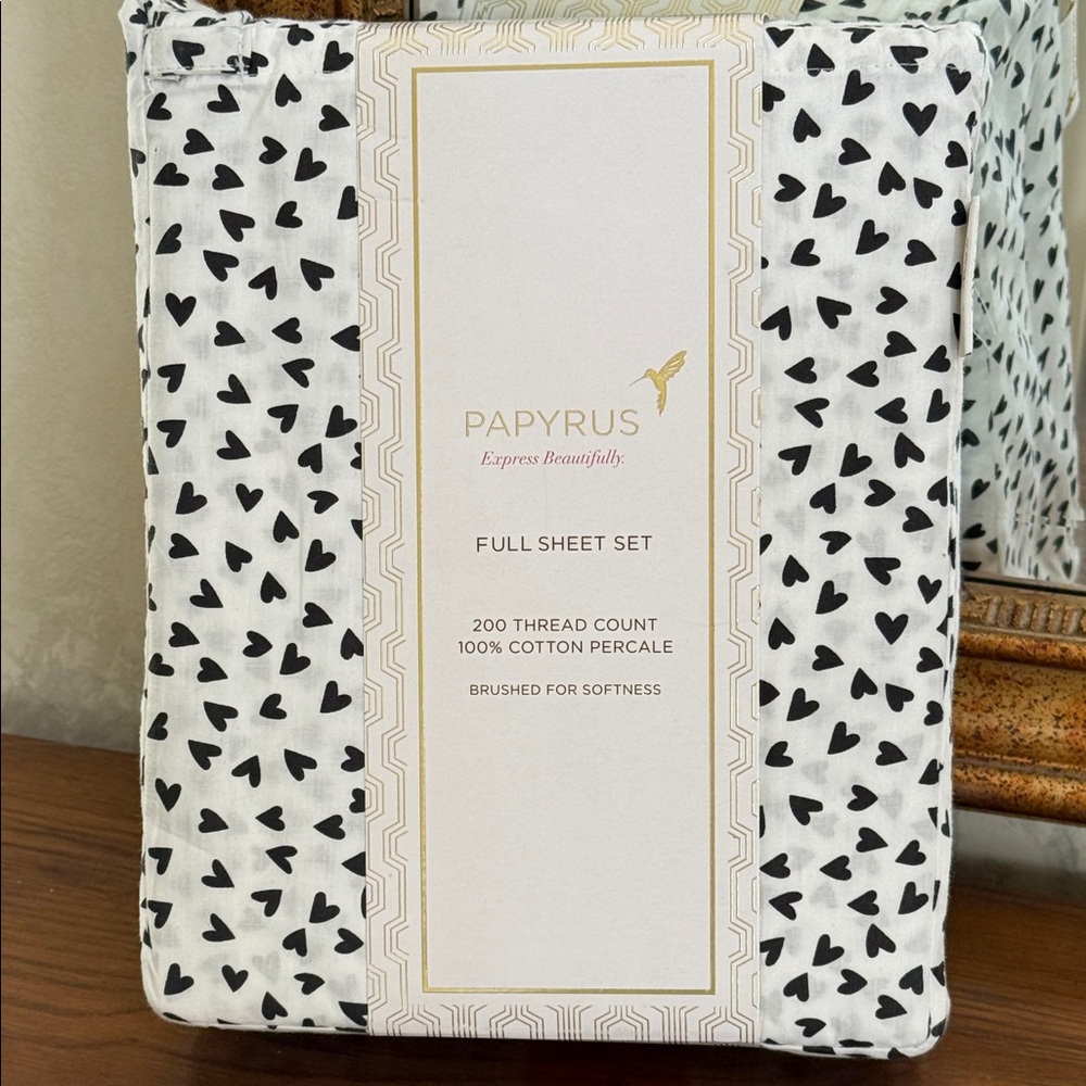 Papyrus Full Sheet Set with White background and black hearts.